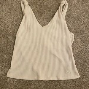 White tank top. Brand- Miss Me. Size- small but fits medium too! Never worn!